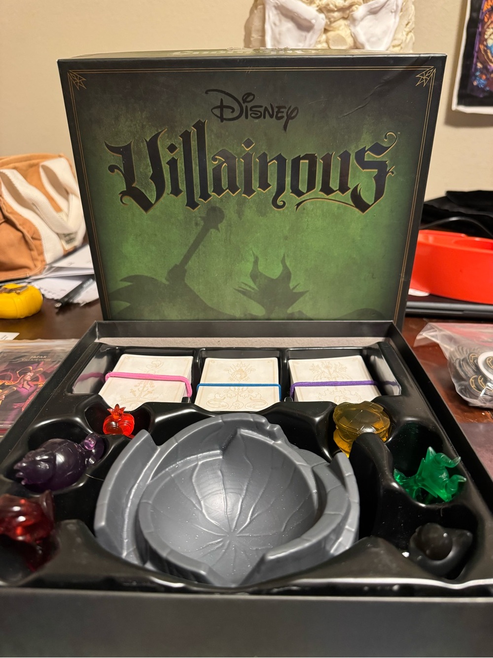 Disney Villainous Board Game with Green Artwork and Multi-Colored Tokens